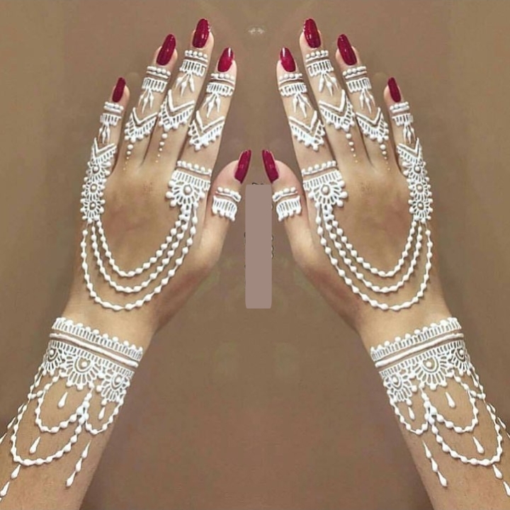 White Henna applied on women hands